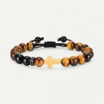 Bracelet croix dorée sur perles œil de tigre